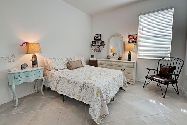 bedroom featuring light tile patterned floors