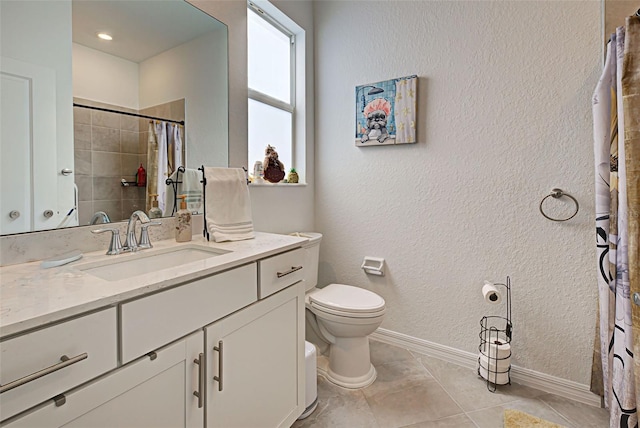 bathroom featuring tile patterned flooring, vanity, toilet, and curtained shower