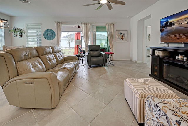 tiled living room featuring ceiling fan