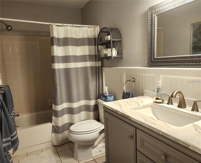 full bathroom with toilet, vanity, tile patterned floors, and shower / bathtub combination with curtain