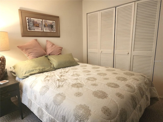 carpeted bedroom with a closet