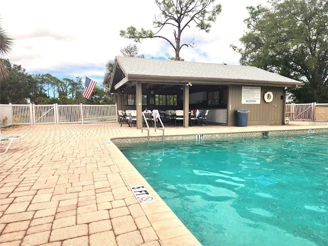 view of swimming pool featuring a patio area