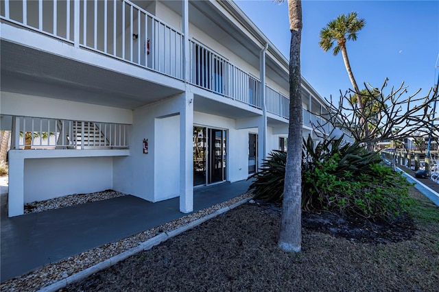 view of side of home featuring stucco siding