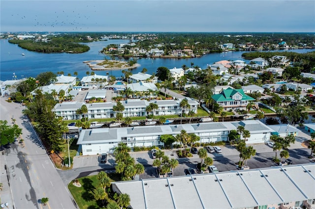 drone / aerial view featuring a water view and a residential view