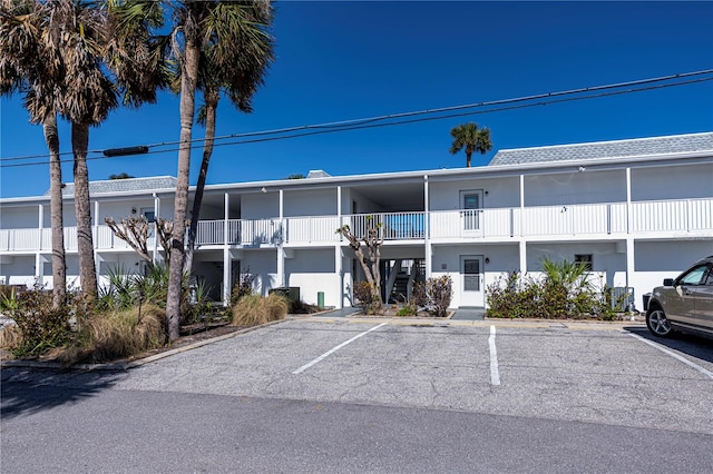 view of property with uncovered parking