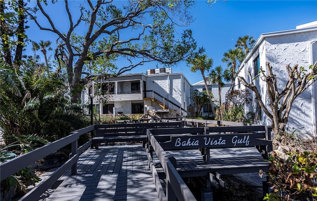 exterior space with stairway and a wooden deck