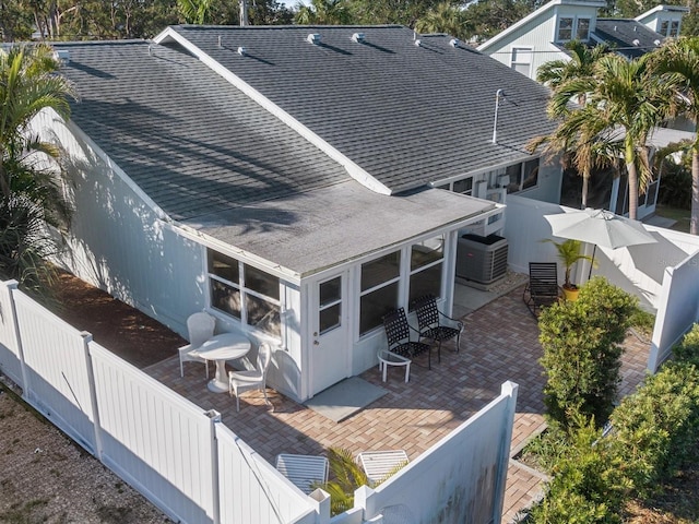 back of property featuring central AC unit and a patio area