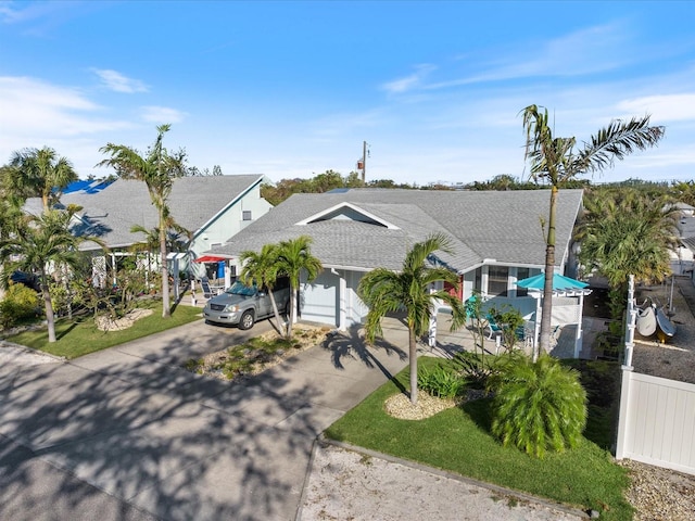 view of front facade featuring a front yard and a garage