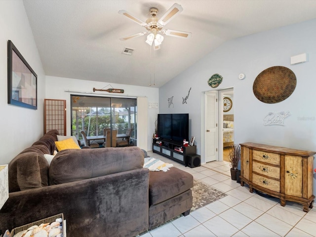 living room featuring light tile patterned floors, a textured ceiling, ceiling fan, and lofted ceiling