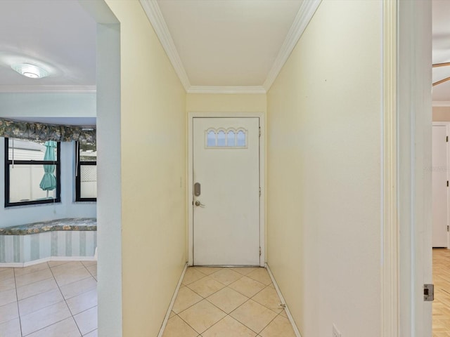 entryway with crown molding and light tile patterned floors