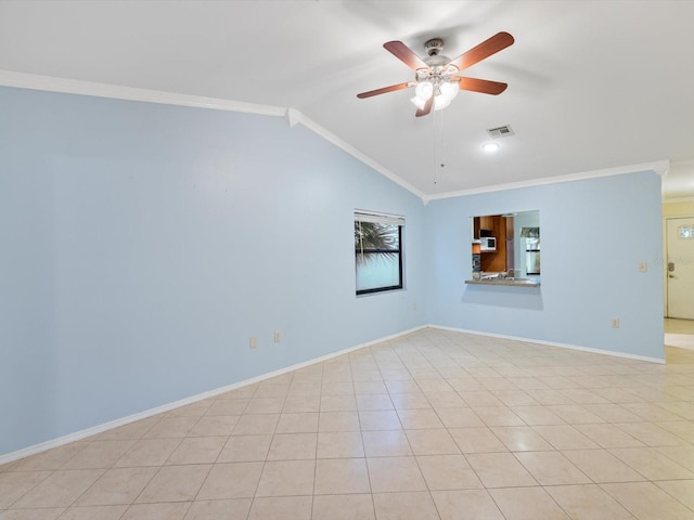 empty room featuring ceiling fan, lofted ceiling, and ornamental molding