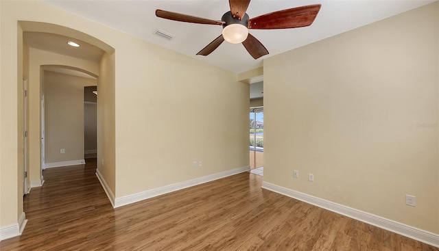 spare room featuring hardwood / wood-style floors and ceiling fan