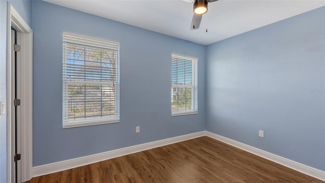 unfurnished room with hardwood / wood-style flooring, plenty of natural light, and ceiling fan