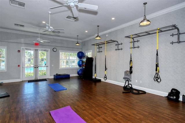 workout area featuring ornamental molding, french doors, dark wood-type flooring, and ceiling fan