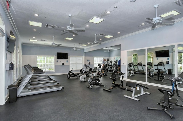 gym featuring ornamental molding and a textured ceiling