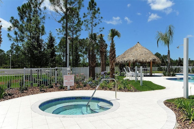 view of swimming pool featuring a gazebo, a patio area, and a hot tub