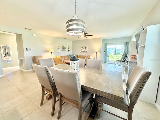 dining area featuring ceiling fan and light tile patterned flooring