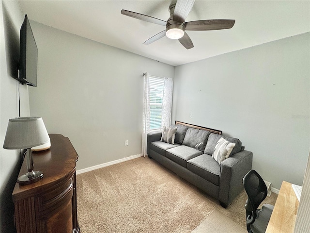 living room with light carpet and ceiling fan