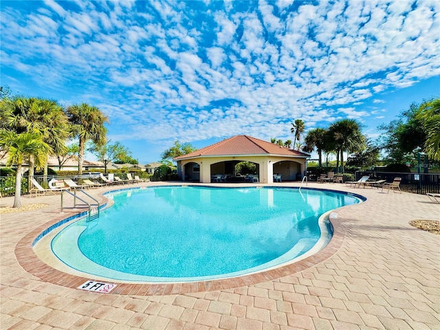 view of pool featuring a patio