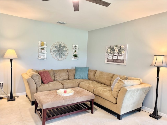 tiled living room featuring ceiling fan