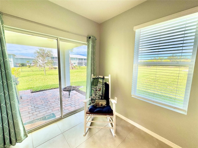 doorway to outside featuring tile patterned flooring