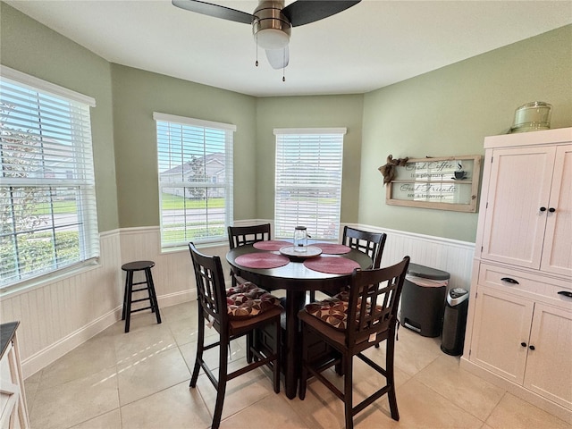 dining room featuring ceiling fan and light tile patterned flooring