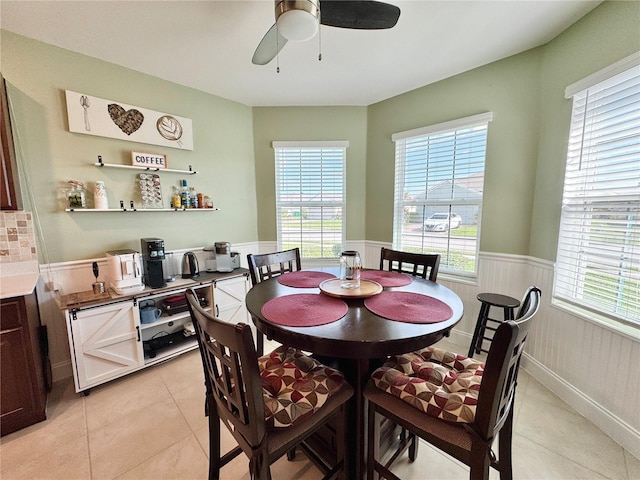 dining area featuring ceiling fan and light tile patterned flooring