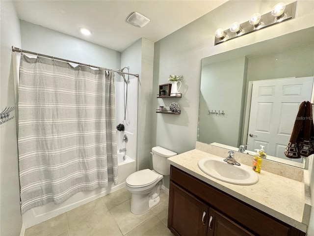 full bathroom featuring tile patterned floors, shower / bath combo with shower curtain, vanity, and toilet