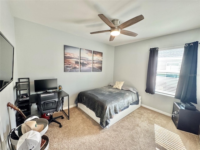 carpeted bedroom featuring ceiling fan