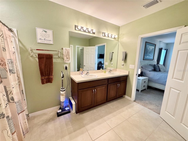 bathroom featuring tile patterned floors and vanity