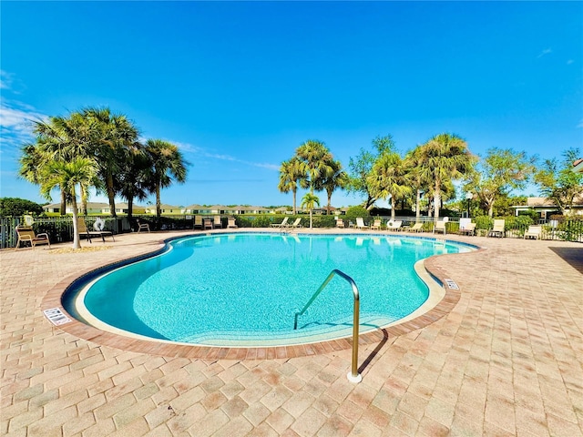 view of swimming pool featuring a patio area