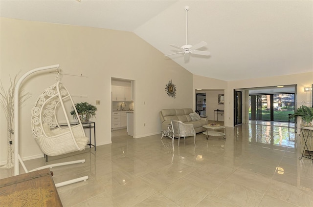 living room with ceiling fan and high vaulted ceiling