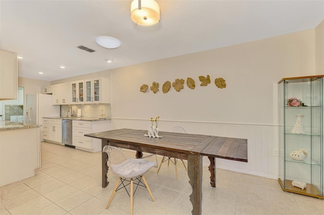 tiled dining area with sink