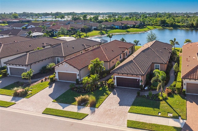 birds eye view of property with a water view