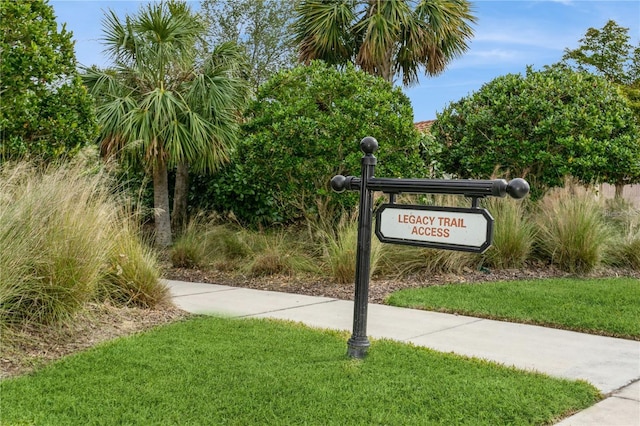 view of property's community with a lawn