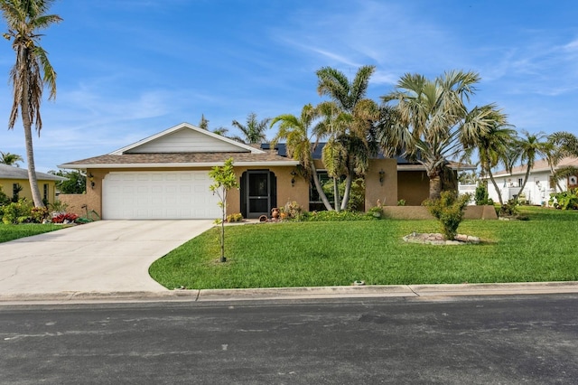 view of front of house featuring a garage and a front lawn