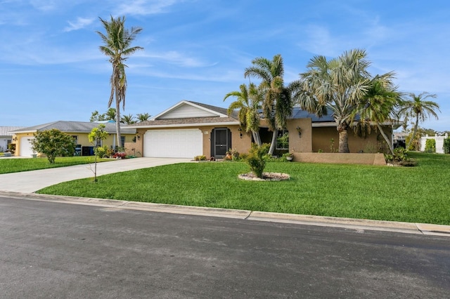 single story home with a garage and a front lawn