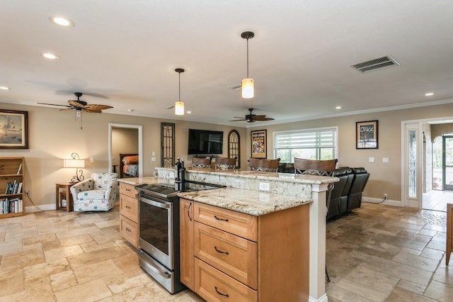 kitchen with light stone countertops, ceiling fan, crown molding, hanging light fixtures, and stainless steel electric range