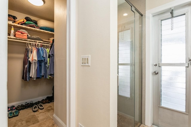 bathroom featuring an enclosed shower