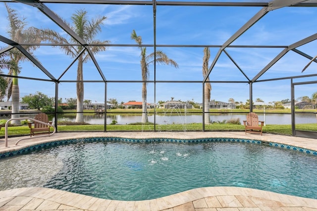 view of swimming pool with a water view, glass enclosure, and a patio area