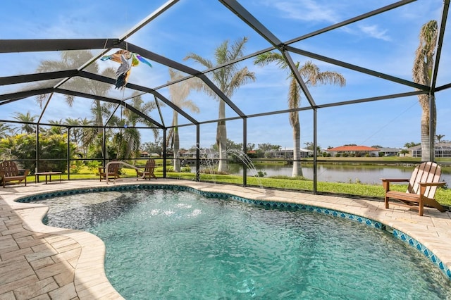 view of pool with glass enclosure, a water view, and a patio