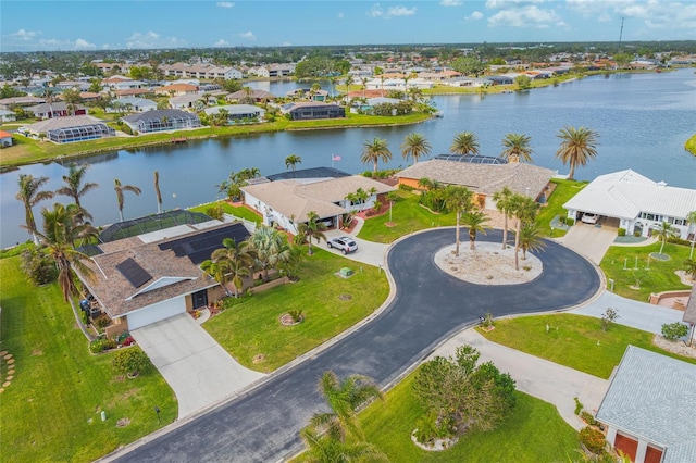 birds eye view of property with a water view