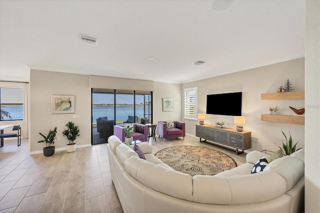 living room with ornamental molding and light wood-type flooring