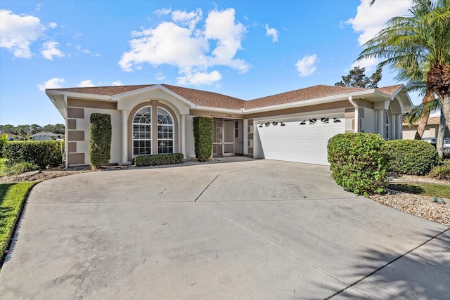 single story home featuring a garage