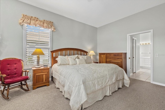 carpeted bedroom featuring ensuite bathroom