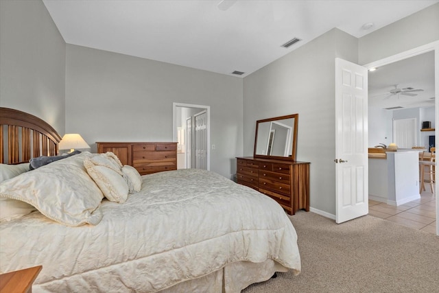 bedroom with ceiling fan and light colored carpet