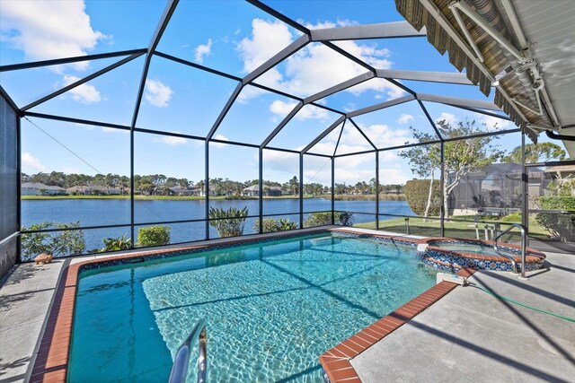 view of swimming pool featuring a lanai, an in ground hot tub, and a water view