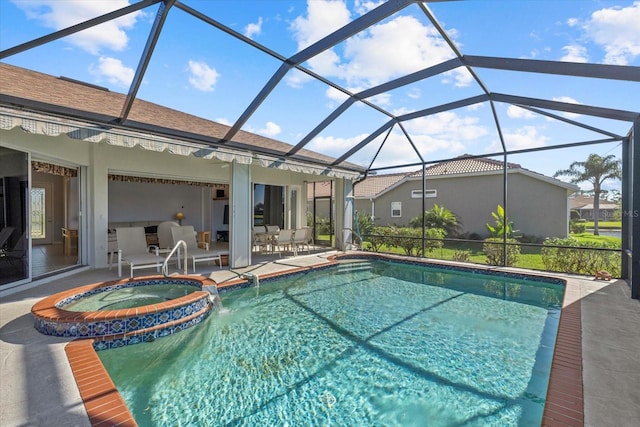 view of pool with an in ground hot tub, a patio, and glass enclosure