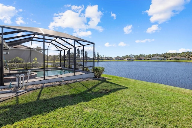 exterior space featuring a lanai, a yard, and a water view