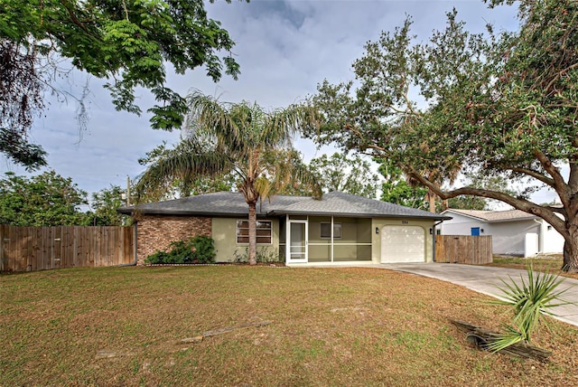 single story home with a front lawn and a garage